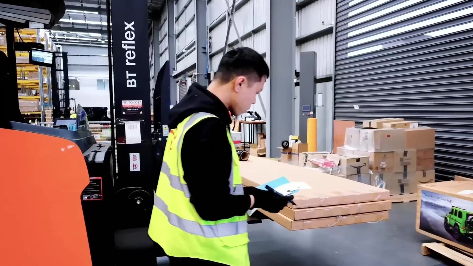 Warehouse team member checking a carton label